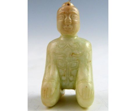 Chinese white and mottled pale celadon jade carved figure of a kneeling man, 6.5cm high,.   