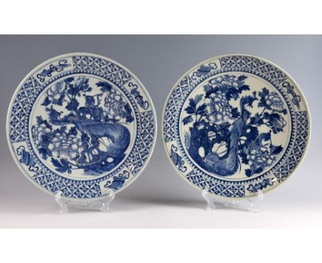 Pair of 19th century Chinese blue and white chargers with decoration of a Phoenix amongst flowers and foliage, 40.5cm diamete
