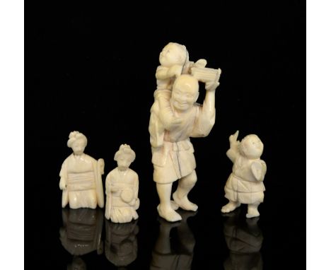 Early 20th century Japanese carved ivory okimono of a man with a young boy on his shoulders, signed to base, 9.5cm high, and 