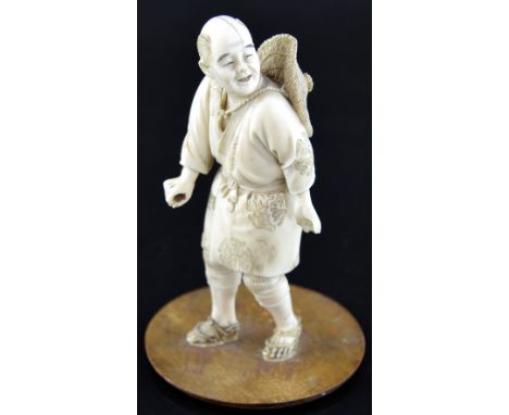 Japanese carved ivory figure of a farmer, on wooden base, 16cm high,PLEASE NOTE: THIS ITEM CONTAINS OR IS MADE OF IVORY. Buye