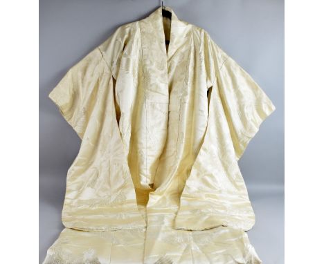 Two silk wedding kimonos, one in pale cream silk damask weave, featuring flying cranes, the other in deep orange, gold lame f