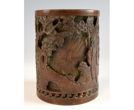 Chinese bronze brushpot with two layers of decoration of figures in a landscape, raised marks to base, 13.5cm high,.   