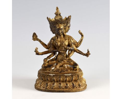 Sino-Tibetan gilt bronze figure of Usnisavijaya, seated in dhyanasana, the hands in various mudras, on a double lotus throne,