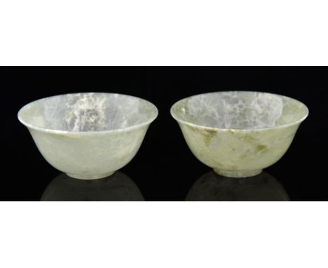 Pair of celadon jade bowls with flared rims, on round feet, each 10cm diameter,.   