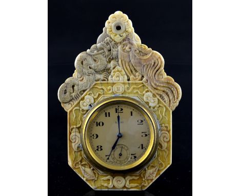 Late 19th century Chinese export carved ivory watch stand, decorated with dragons, exotic birds, objects, foliage and cloud b