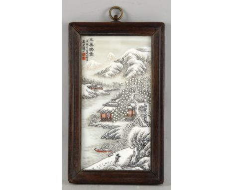 Chinese porcelain plaque in the style of He Xuren, depicting a winter scene with a figure and a boat in a landscape, with cal