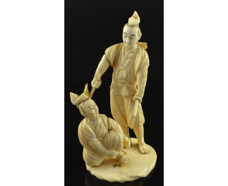 19th century okimono of a Samurai holding a sword, another kneeling in front of him. Meiji period, signed on base,16 cms high