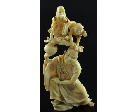 19th century Japanese carved ivory okimono, a male figure holding another figure and a devil above his head, Meiji period, si