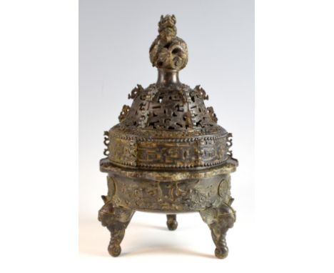 Chinese bronze censer and cover with coiled dragon finial, pierced and scrolling decoration on a base decorated with phoenixe