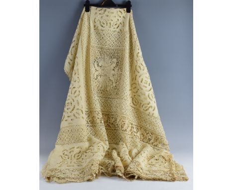 An Edwardian cream lace and cutwork bedspread, profusely decorated with coats of arms from European countries, including  Fra