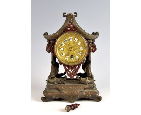 Chinese spelter clock in the form of a pagoda, with single train movement, the gilt dial with enamel cartouches and Chinese n