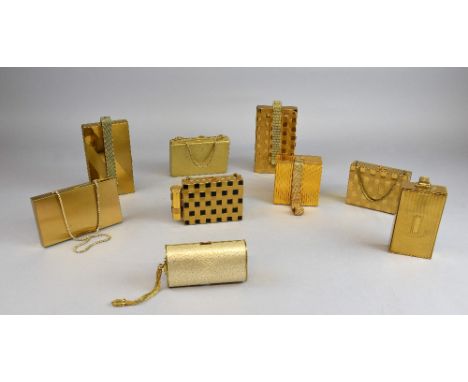 1950's gilt metal fitted carryalls (9) in a variety of finishes, including basketweave effect, engine turning, craquelure , b