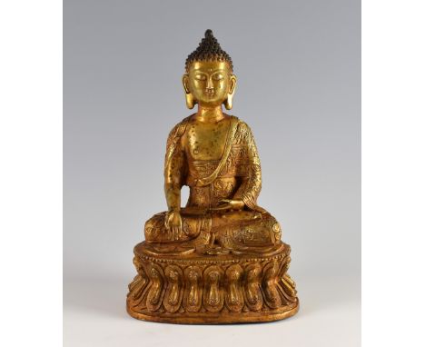 Chinese gilt bronze Buddha on double lotus throne, Kangxi six character mark but later, 28.5cm high,PROVENANCE: Acquired by t