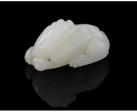 Chinese pale celadon carved jade recumbent lion, 4cm long,.   