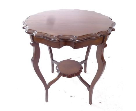 A mahogany 2-tier lamp table of shaped form, W62cm H72cm 