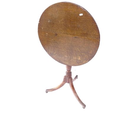 A Georgian oak tilt-top lamp table, on tripod base, W60cm, H74cm 