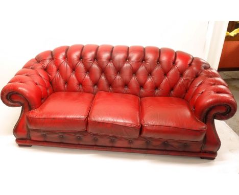 A red leather button-back 3-seater Chesterfield sofa, overall length 225cm, H70cm, D100cm, seat length 145cm, height 40cm and