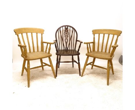 A pair of modern pine stick-back kitchen armchairs, and an oak and elm-seated wheel-back elbow chair (3) 