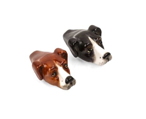 Royal Worcester porcelain pair of hound head whistles, one in black, one in tan, one with a puce mark to the base, 4.5cm over