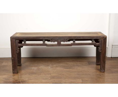Hardwood bench/low tableChinese, with carved sides, 116cm long x 34.5cm deep x 45.5cm high  Worn and with old repairs.