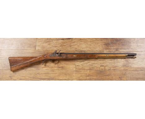Flintlock riflewith a walnut stock, engraved plate and BP proof mark,113cm in length  With signs of wear consistent with age 