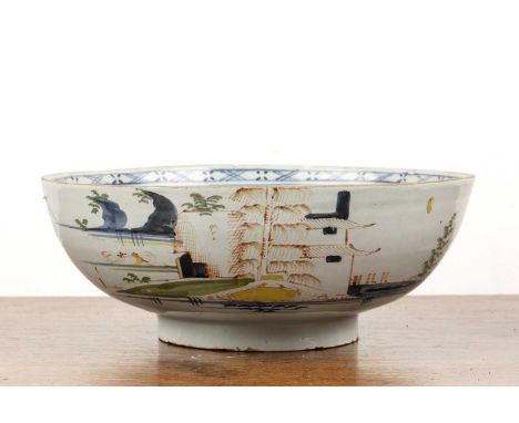 Delftware bowlEnglish, circa 1770, painted in the Chinese taste, 27cm diameter x 10cm high  Chips around the rim and foot and