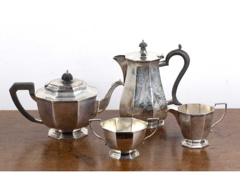 Art Deco three piece silver tea set comprising a teapot, milk jug and twin handled sucrier, the teapot with ebonised handle, 