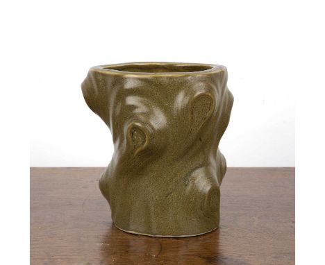 Tea dust glazed brush potChinese, mid-20th Centuryof knotted tree trunk form, and with a zhuanshu Qianlong seal mark, 15.5cm 
