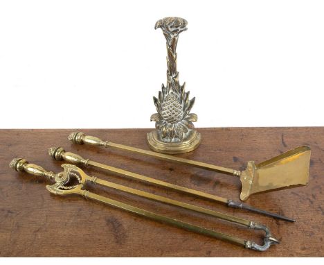 Victorian brass door portermodelled as a pineapple, 35cm high and a brass and wrought iron fire tools, with decorative floral