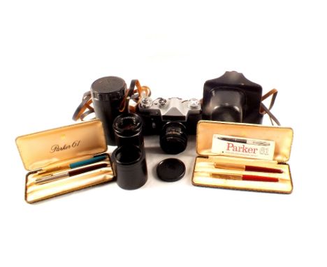 Four vintage Parker pens, a Zenit-E camera plus a spare lens in leather case and carrier