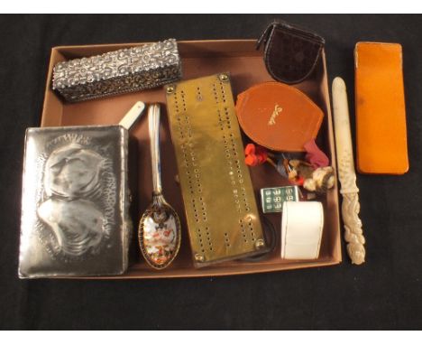 A tray of miscellaneous items including embossed silver plated box, bone handled magnifier, travelling clock, pewter lidded b