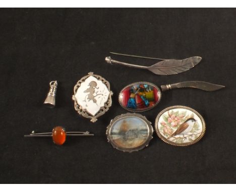 Seven silver brooches, one with enamel decoration, one painted on ivory, one in the form of a feather etc plus a small pendan