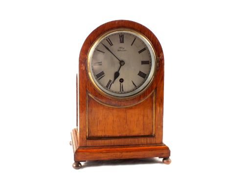 An oak cased mantel clock with Junhans movement, dial marked Kay Worcester with G.W.R. Railway label to interior