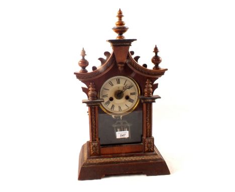 A German carved pine mantel clock