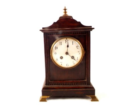 A mahogany cased and brass mounted striking mantel clock