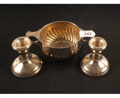 A silver sucrier plus a pair of squat candlesticks