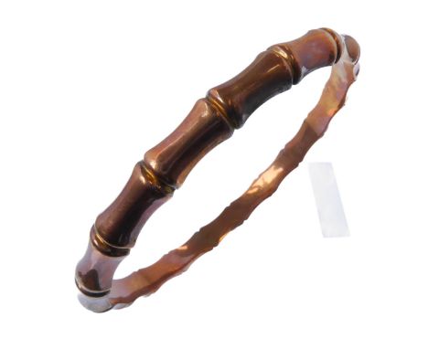 A 9-carat yellow gold bangle of hollow 'bamboo' design, Birmingham hallmark (inner diameter 7.5cm approx., 10g)Condition Repo