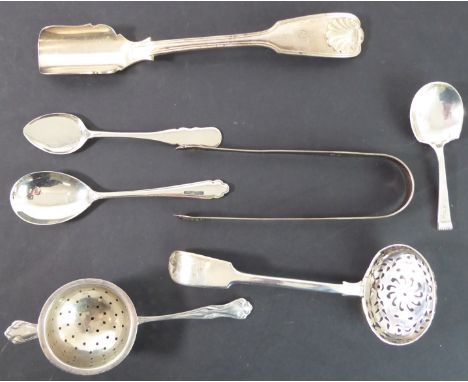 Six pieces of hallmarked silver and one of silver plate:the hallmarked silver comprising an early 20th century tea strainer, 