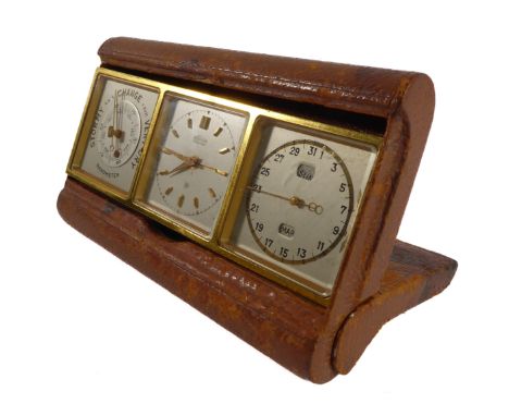 An early / mid 20th century leather-cased travelling clock set comprising separate barometer, clock signed 'Angelus' (threeso
