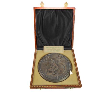 A heavy metal commemorative plaque, the Austin Twenty-Five Year Plaque: obverse with Hermes surrounded by the script&nbsp;'Co