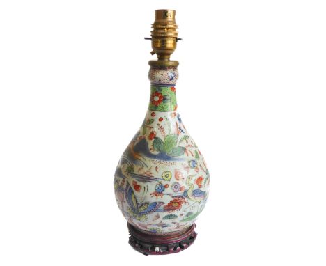 A 19th century Chinese porcelain 'garlic mouth' vase of baluster form: hand decorated in enamels with butterflies, a crane an