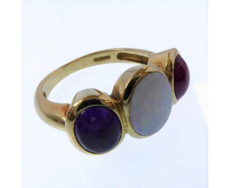 An opal, ruby, amethyst and 18-carat yellow gold ring, each oval cabochon collet set to the wide band stamped '750', Birmingh