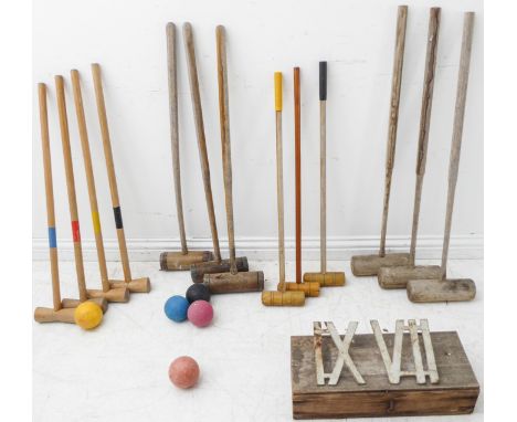 Six antique and seven modern croquet mallets, five balls and a cased set of ironwork Clock Golf (Army &amp; Navy)