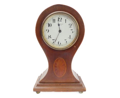 An Edwardian mahogany, boxwood strung and marquetry patera 'balloon' mantle clock: the white enamel dial with Arabic numerals