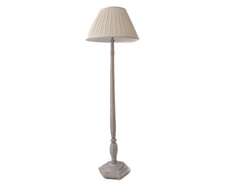 A limed oak standard lamp with hexagonal base and&nbsp;pleated shade&nbsp;(approx. 180cm high (including shade)