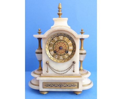 A 19th century marble and gilt-metal-mounted eight-day mantle clock: the broken arch style pediment surmounted with a gilt fi