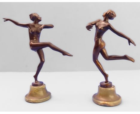 A pair of Art Deco period patinated bronze sculptures of dancing female nudes by Lorenzl (Josef) (1892-1950): each dancer on 