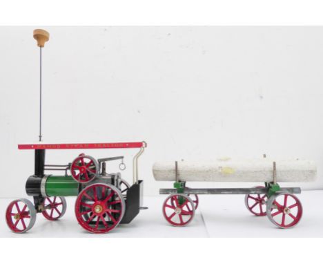 A working Mamod model stream tractor engine complete with a trailer carrying model tree trunks (25cm wide) (2)