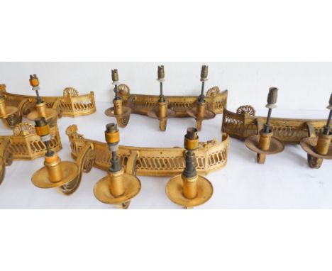 An unusual set of five early 20th century gilt-metal three-light serpentine-fronted wall appliques; each with pierced beaded 