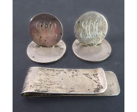 Two heavy hallmarked silver menu-holders / place names, each engraved 'MH', together with a Tiffany &amp; Co sterling silver 